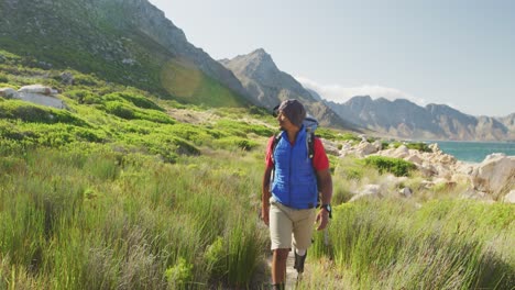 Sporty-mixed-race-man-with-prosthetic-leg-hiking