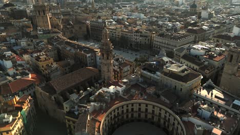 Aerial-morning-view-of-Redona-town-square-and-Church-of-Santa-Caterina-in-Valencia-old-Town,-Spain