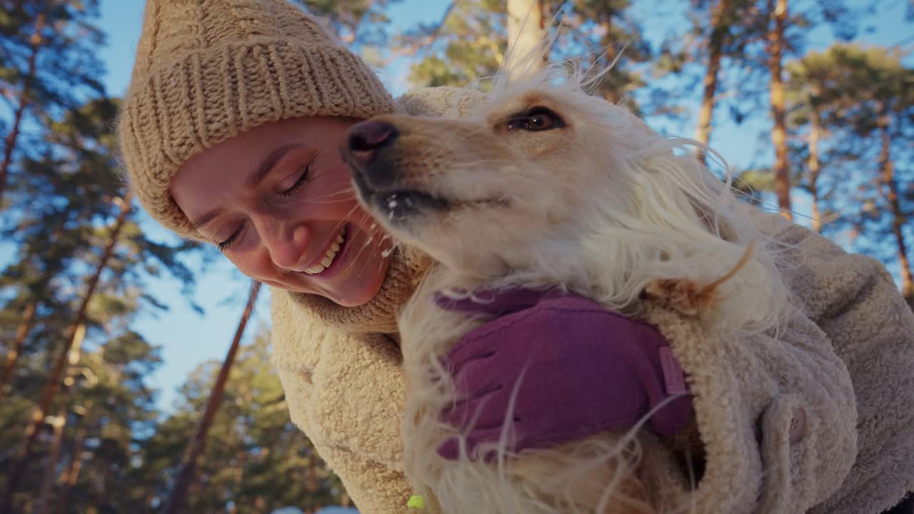 Woman and her Ahani Dog in a Winter Forest