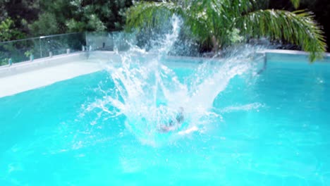 Businessman-jumping-in-the-swimming-pool