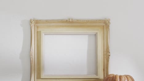 video of pumpkin with autumn leaves and frame with copy space on white background