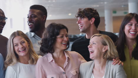 portrait of smiling business team working in modern office together