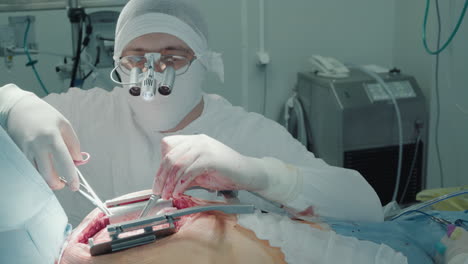 doctor focus on laser heart operation. surgeon uses laser scalpel for coronary artery bypass surgery prioritizing patient safety and meticulous execution