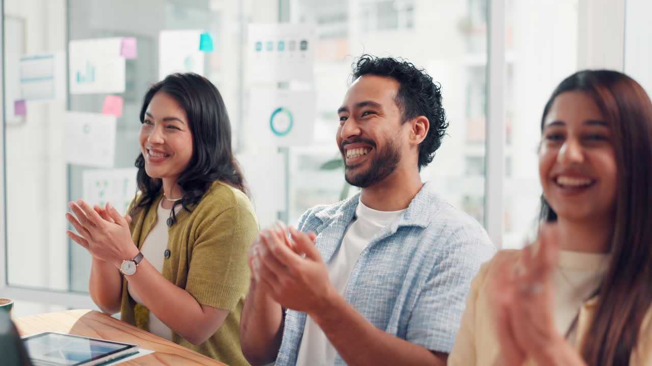 Business team clapping in office