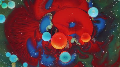 colorful bubbles. abstract red, yellow, blue, green mixture on a black background. artistic color paint background.