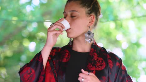 woman drinking tea in a kimono