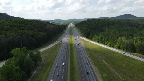 camera is moving towards oncoming traffic as it passes on the interstate