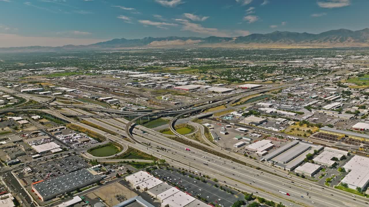 Traffic crossing on complex highway with downtown cityscape