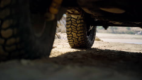 a tire of a car parked on a beach