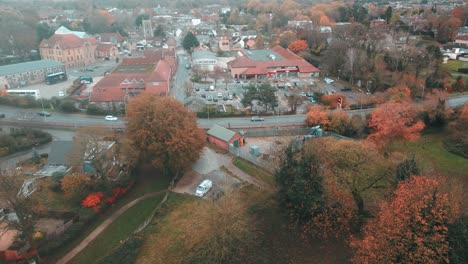 Ascending-pedestal-drone-shot-of-Thetford-Town,-a-community-located-in-Breckland,-Norfolk-in-United-Kingdom