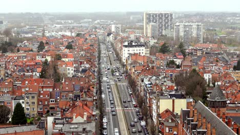 A-zoomed-in-video-of-a-busy-street-in-Brussels,-Belgium-from-a-top-down-view