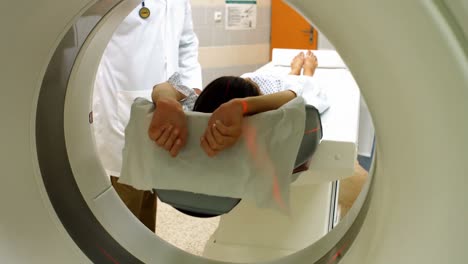 A-patient-is-loaded-into-an-mri-machine