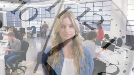 Woman-standing-in-an-office-with-clock-ticking-in-the-foreground