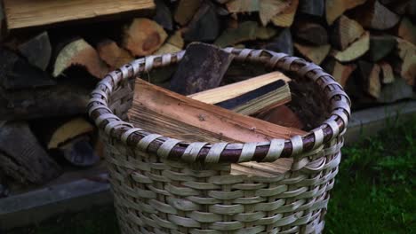 fresh cut wood in a basket to bring back in to the house in winter