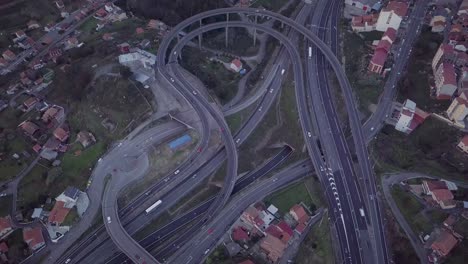 aerial approach to a highway intersection construction in a rural area at sunset in spain