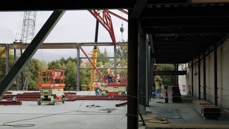 construction workers erecting steel beams for a new building