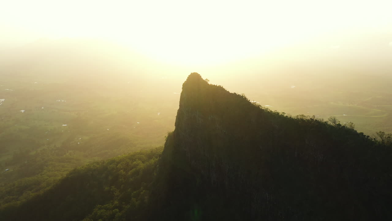 Aerial shot at sunset of the Pinnacle Point mountain at Border Ranges National Park, New South Wales in Australia
