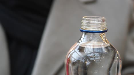 close-up of a water bottle with a blue lid