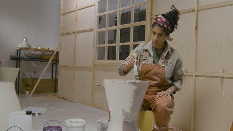 woman painting table