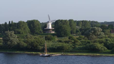 De-Koe-molen-amongst-trees-in-Veere,-Zeeland,-the-Netherlands