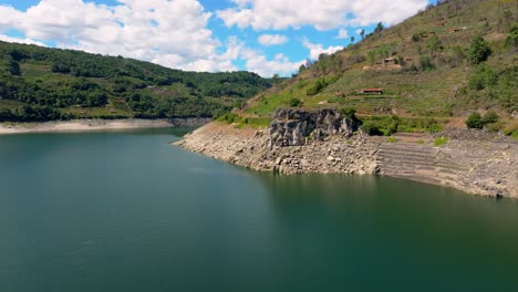 rocky cliffs and mountain around the belesar reservoir in the miño river, spain