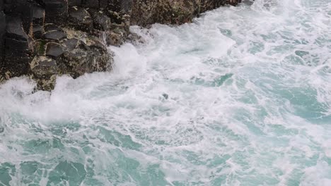 dynamic ocean waves hitting a rugged coastline