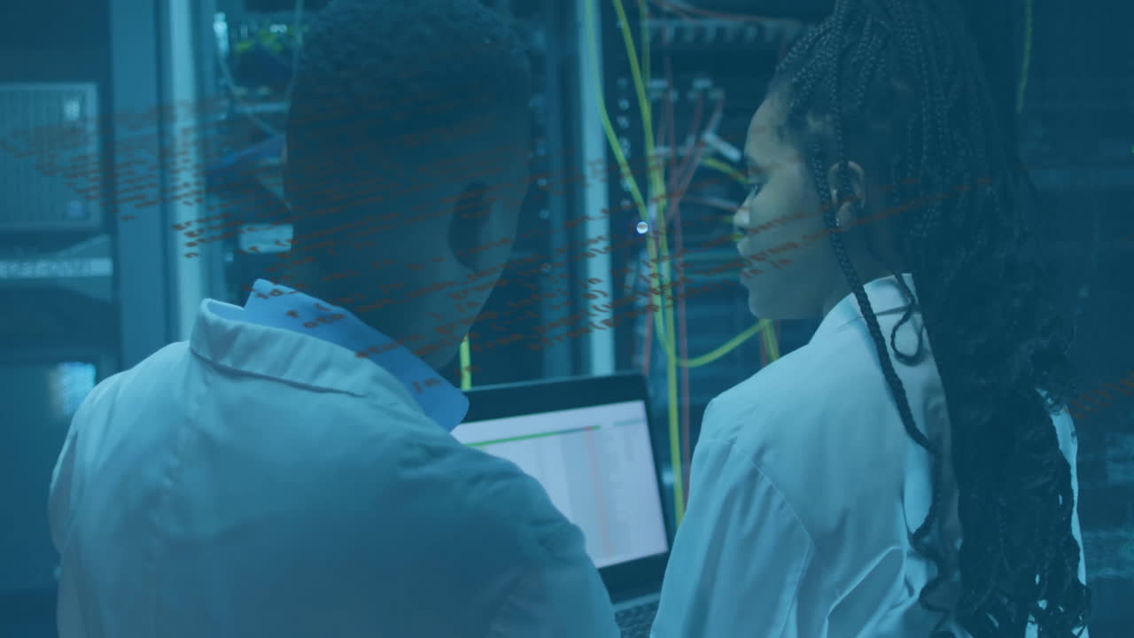 Analyzing data, scientists in server room with laptop and cables