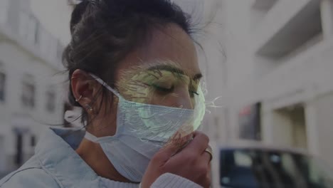 animación de células de covid-19 que se mueven sobre una mujer con máscara facial