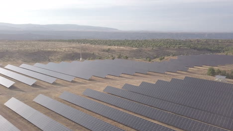 aerial view of a solar farm in a desert landscape