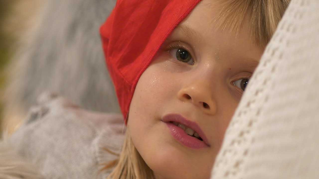 Portrait of Cute Mischievous Girl with positive expressions, On Christmas Eve, waiting for Santa Claus