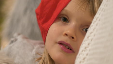 portrait of cute mischievous girl with positive expressions, on christmas eve, waiting for santa claus