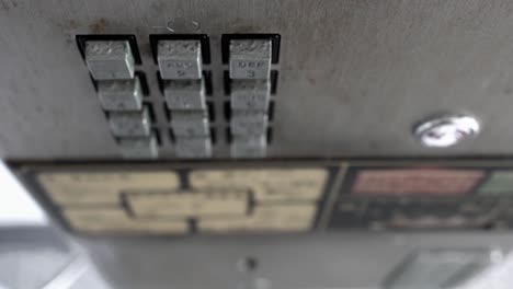 closeup of public phone buttons. over look.