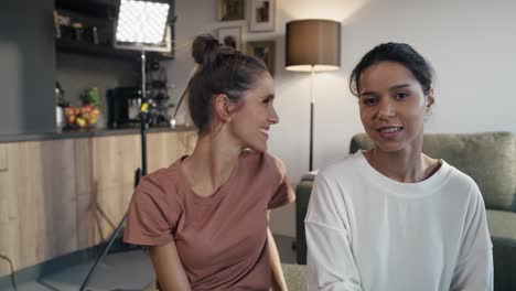 two female vloggers greeting to the camera