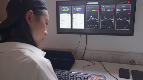 Serious-ethnic-female-trader-analyzing-cryptocurrency-market-statistics