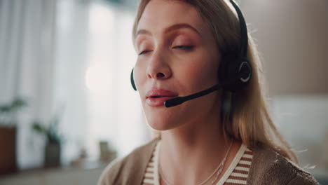 woman wearing a headset and looking at the camera