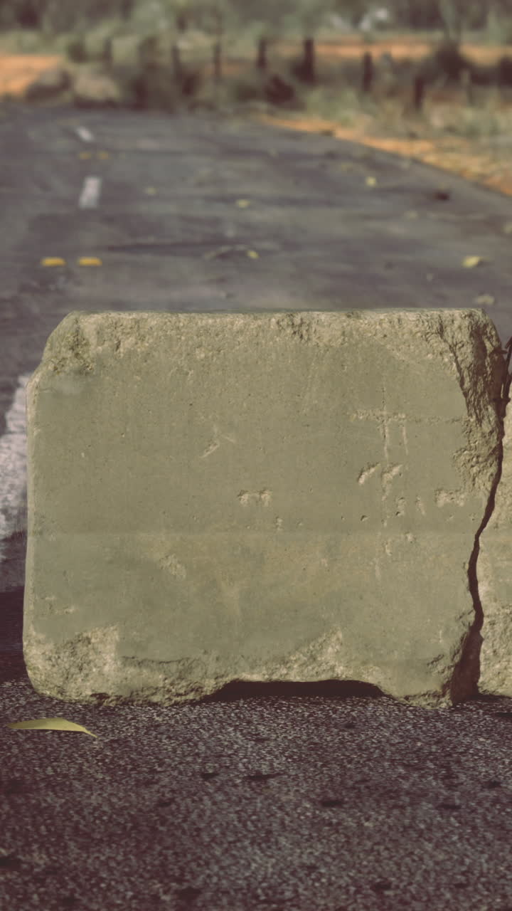 Road barricade blocking a deserted path in a remote desert landscape