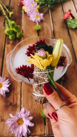 smudging ritual with flowers and crystals