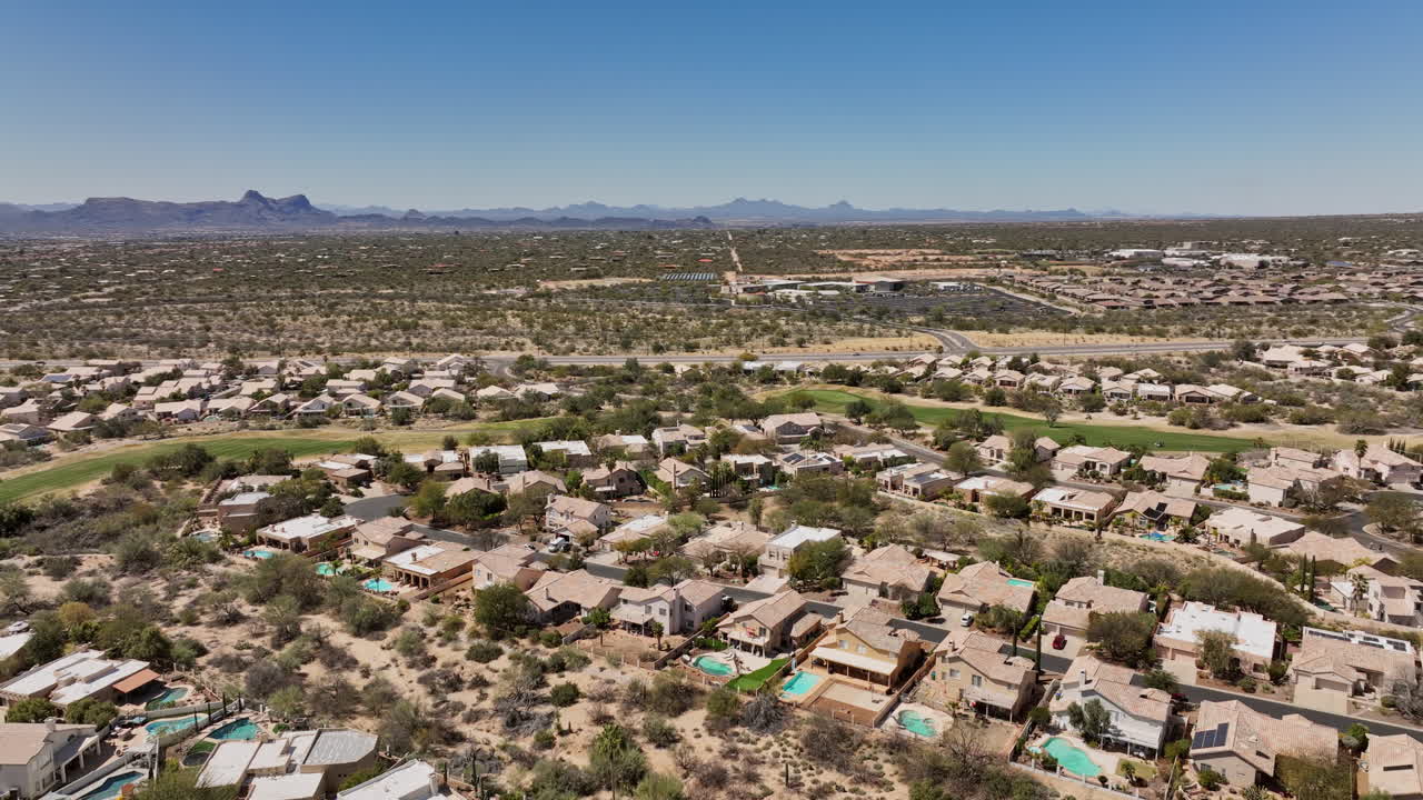 Tucson Arizona Aerial v7 flyover and around Oro Valley Canada Hills neighborhoods with golf course, capturing panoramic views of mountainscape and desert views - Shot with Mavic 3 Cine - March 2022