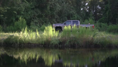 a truck driving on a country or dirt road