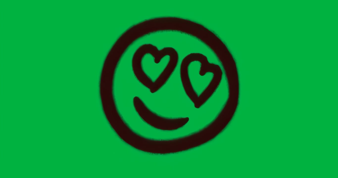 All'avvio: emoji sorridente con occhi a cuore e alone pulsante, un motivo mutevole si ripete su sfondo trasparente.