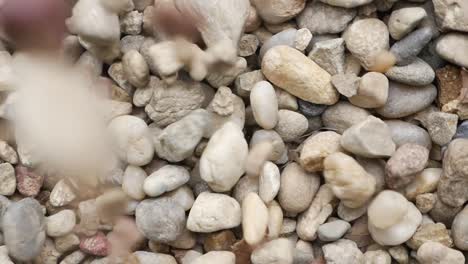 close-up of falling and piled gravel stones