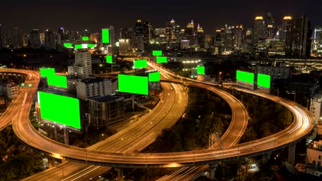 day to night time lapse city landscape cityscape at bangkok city with green screen billboards for your own messages.