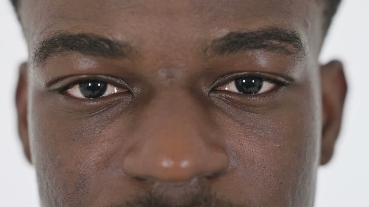 Close up of Blinking Eyes of African Businessman