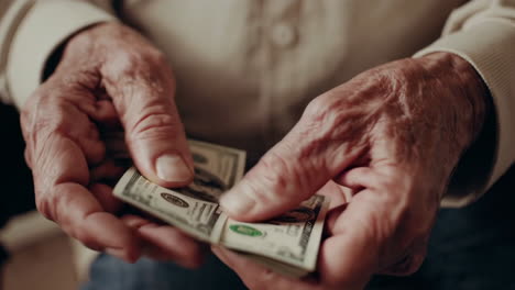 old man counting money