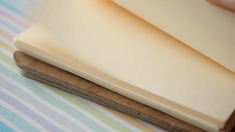 close-up of an open notebook with blank pages