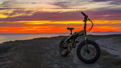 time lapse: amazing sunset and bicycle in the foreground