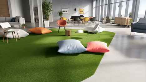 modern office lounge area with green carpet and colorful cushions