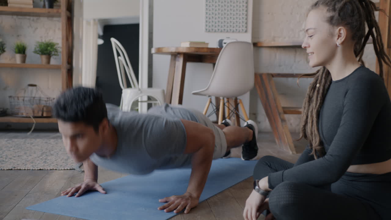 Couple Doing Push-ups at Home