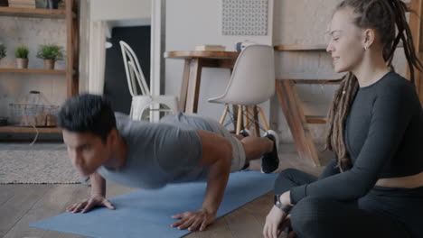 couple doing push-ups at home