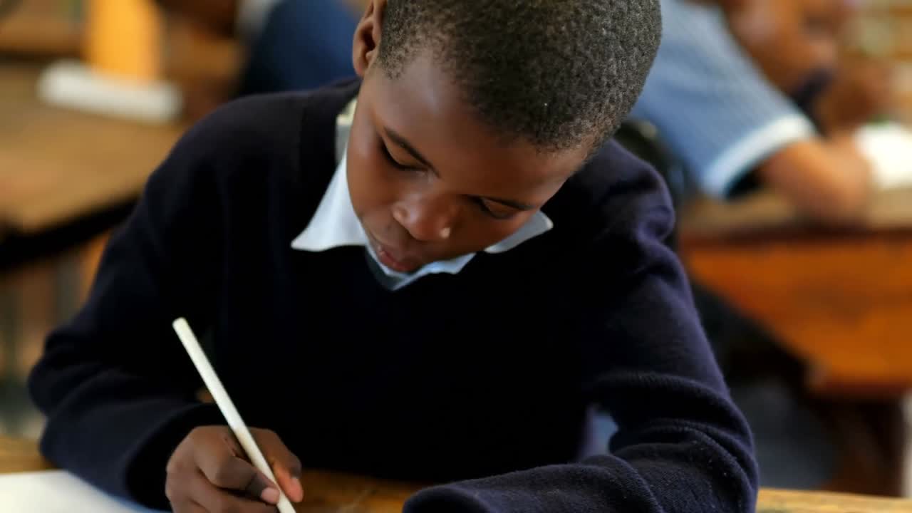 Schoolboy studying in the classroom at school 4k